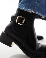 ankle boots with buckle details in black