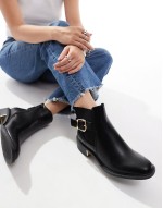 ankle boots with buckle details in black